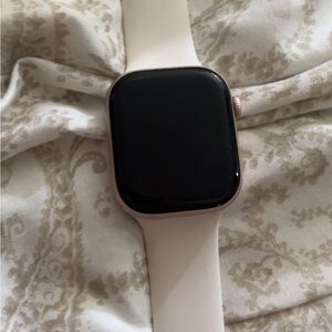 Apple Smartwatch with Black Display and Cream Band